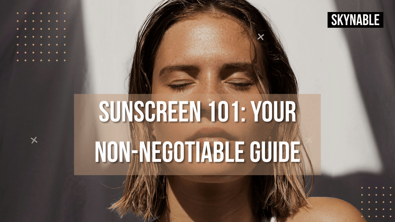 A bottle of sunscreen next to a green leaf